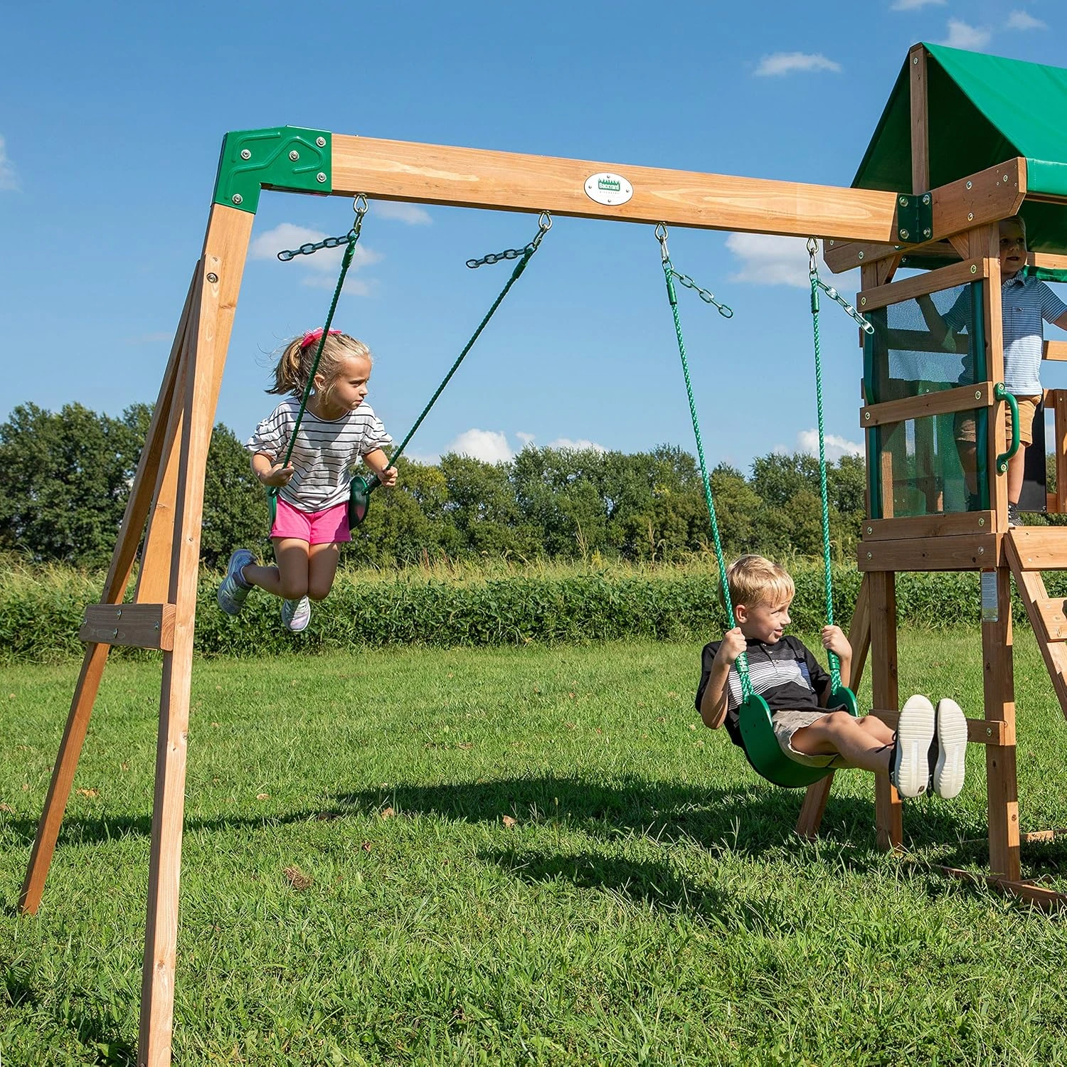 Backyard Discovery Buckley Hill Cedar Wood Swing Set with Wave Slide, Play Deck, Rock Wall Ladder, Belt Swings, Chalkboard, Canopy Roof, Outdoor Playset - Image 4