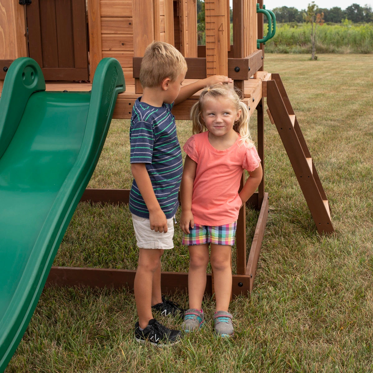 Backyard Discovery Echo Heights Cedar Wooden Elevated Kids Playhouse with Wave Slide, Play Kitchen, and Deck - Image 6